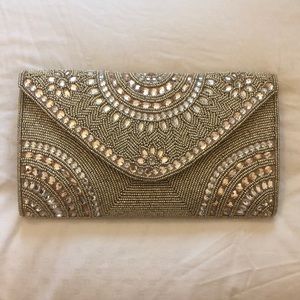 Hand beaded envelope clutch.